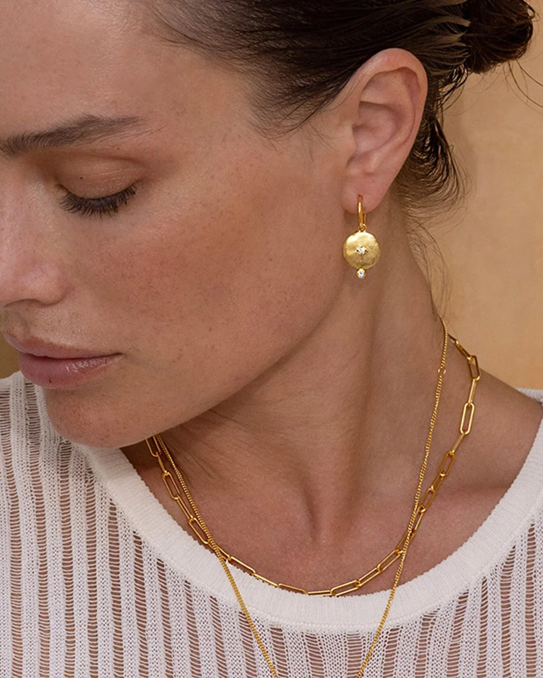 Rose Gold Goddess Earring shown alongside gold and silver variants