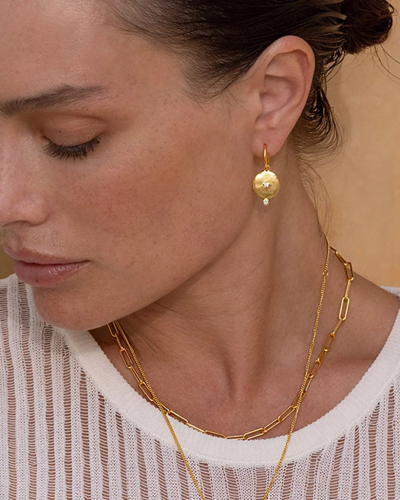 Rose Gold Goddess Earring shown alongside gold and silver variants
