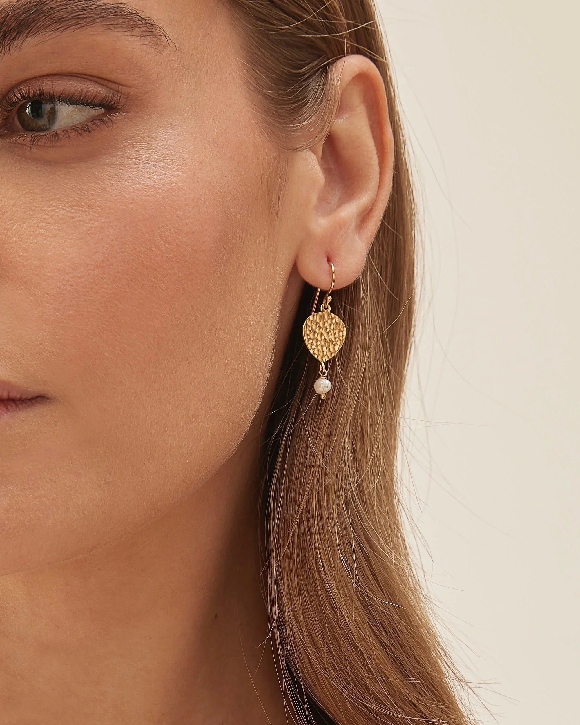Maya Pearl Earring worn on the ear