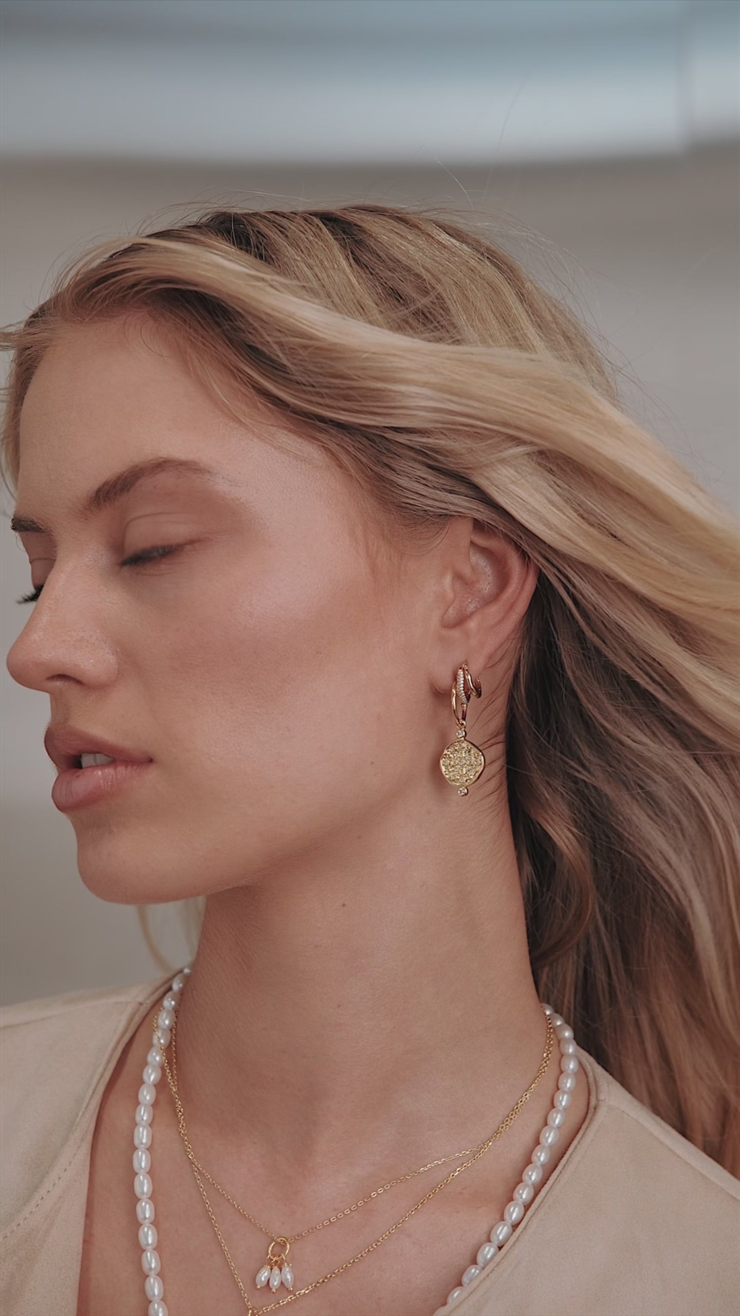 Earth Coin Huggie Gold product video, Nicole Fendel Jewellery