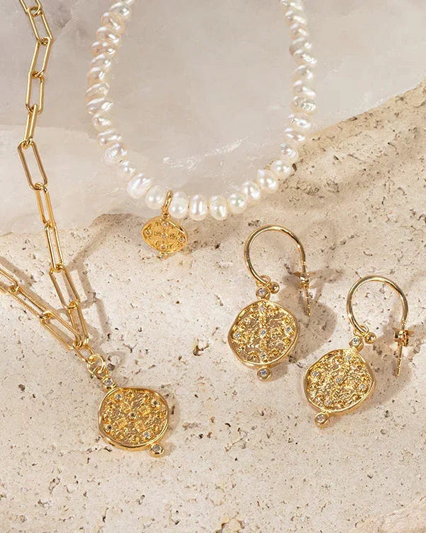 Earth Coin Huggie 18k